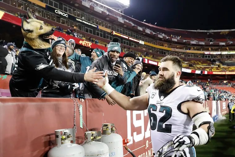 Eagles center Jason Kelce gave high-fives to fans after last year's game at Washington.