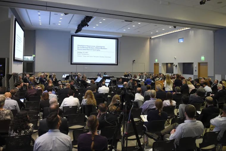 The Cellular, Tissue, and Gene Therapies advisory committee and members of the public listen to testimony concerning the approval of a potentially breakthrough drug for a form of blindness at the FDA in Silver Spring, Md.