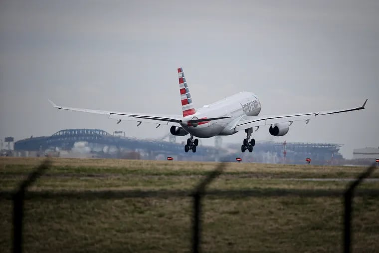 An American Airlines flight from Paris arrives at Philadelphia International Airport on Thursday. The route is now suspended through May 6.