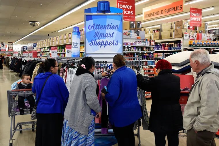 Attentive Kmart shoppers check out Thursday’s Bluelight Special — 2-pair pajama sets — at the Aramingo Avenue store.