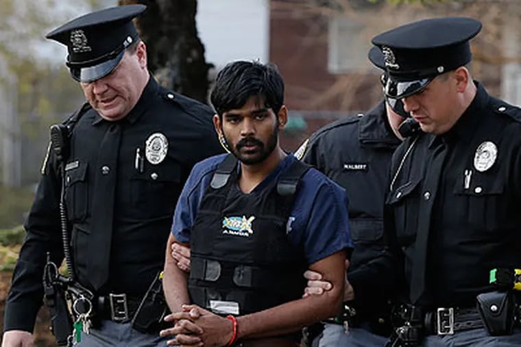 Raghunandan Yandamuri is escorted to a Montgomery County district court for a preliminary hearing Wednesday, Nov. 28, 2012, in Bridgeport, Pa. Investigators said Yandamuri killed 10-month-old Saanvi Venna and her grandmother Satyavathi Venna in a botched ransom kidnapping. He is being held without bail on murder, kidnapping and other charges. (AP Photo/Matt Rourke)