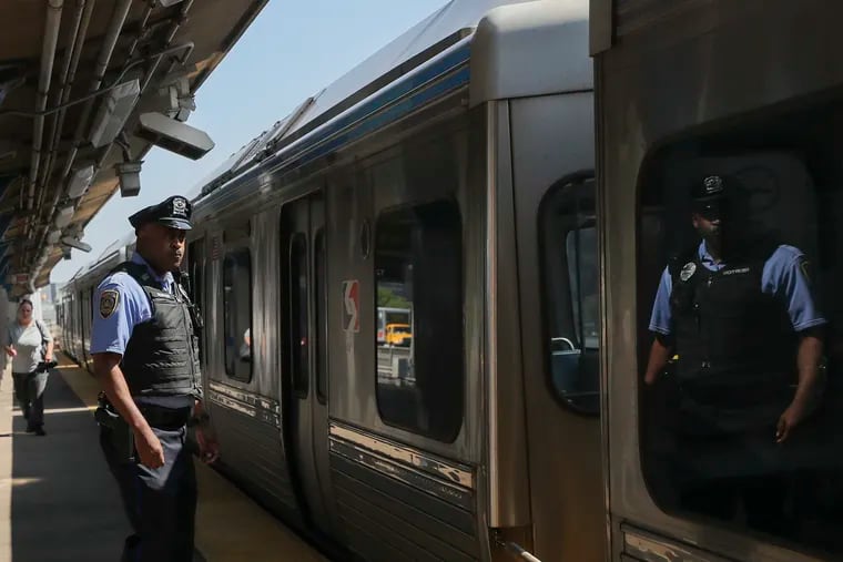 SEPTA police officer Kevin Newton on the platform of Spring Garden station as an eastbound El train departs in Philadelphia on Wednesday, May 31, 2023.