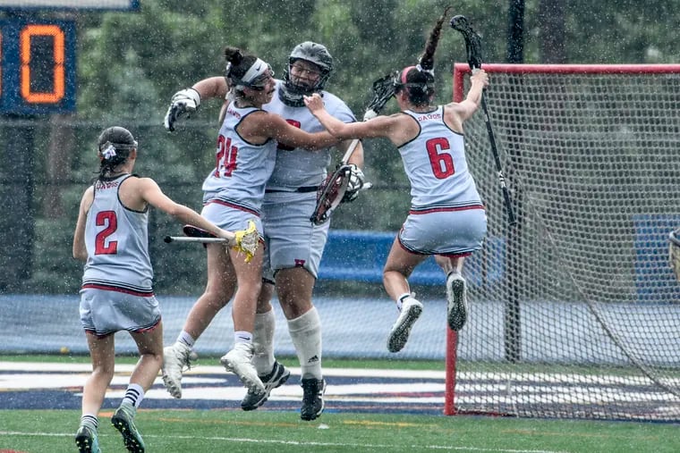Haddonfield players jump for joy after winning the state Group 2 lacross championship. 