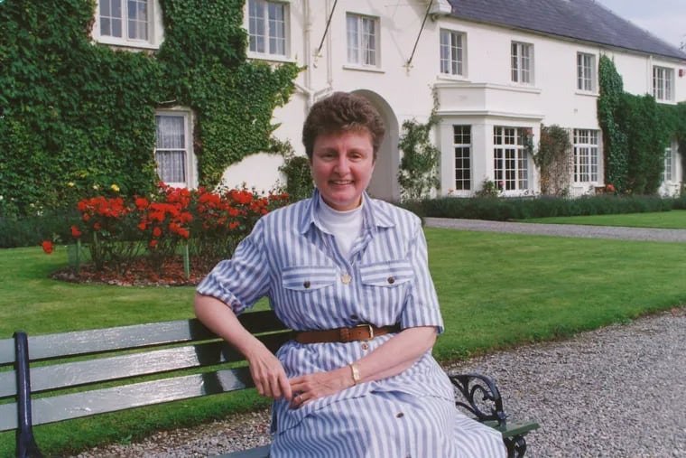 Sister Pauline McShain is seen sitting in the garden of her parents' former estate, Killarney House, in Kerry County, Ireland. The estate is now a national park.