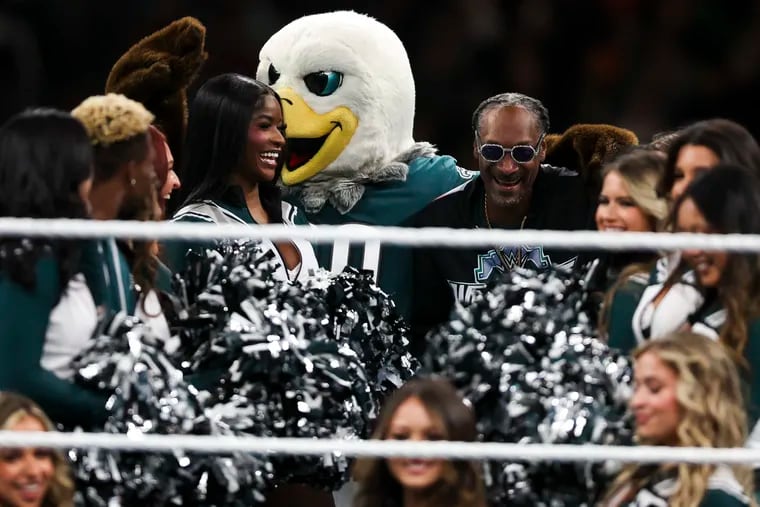 Snoop Dogg dances with Swoop and the Eagles cheerleaders during WrestleMania 40 at Lincoln Financial Field in Philadelphia, Pa. on Sunday, April 7, 2024.