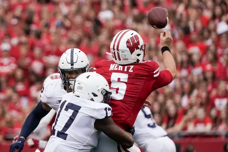 Penn State's Arnold Ebiketie hits Wisconsin's Graham Mertz as he throws during their game on Sept. 4 in Madison, Wis.