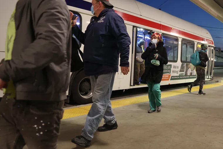 Riders step off of the Route 109 bus on Friday, April 17, 2020. SEPTA has changed services during the coronavirus pandemic, but some members of the Transit Workers Union believe the agency is not sufficiently protecting workers.