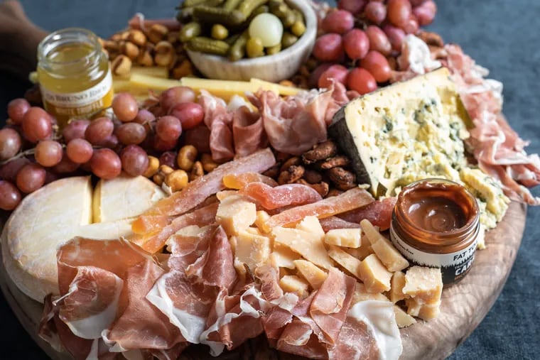 You can buy or build your own custom cheese boards and charcuterie trays like these from Di Bruno Bros., which has several locations throughout the region.