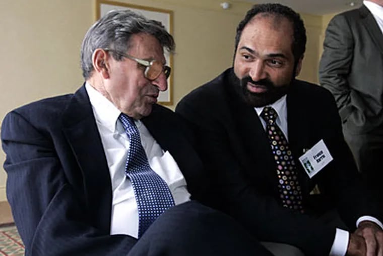 Franco Harris, right, was fired by a Pittsburgh-area casino for his public support of Joe Paterno. (Gene J Puskar/AP Photo)