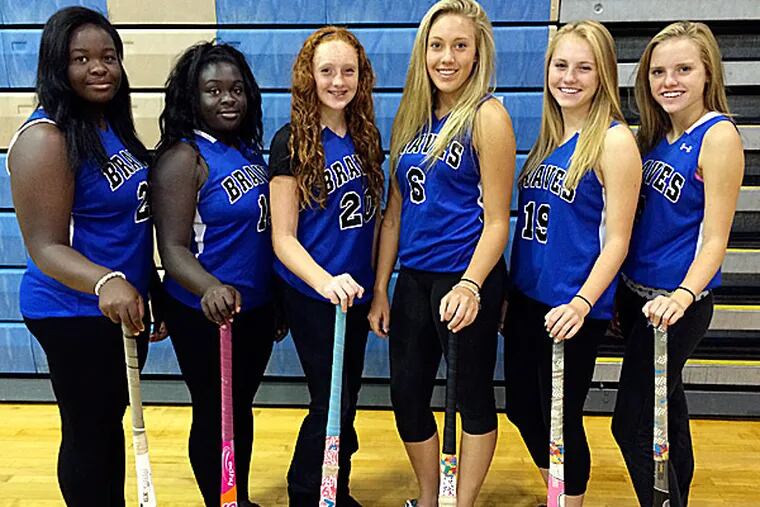 The Williamstown field hockey team has three sets of sisters. From left are Deborah and Gloria Adebowable, Kate and Kamryn McKinney, and Jamie and Allie Trimble. (Handout photo)