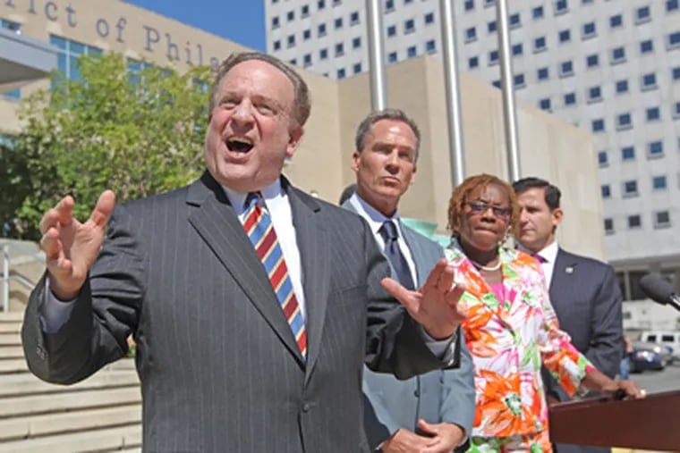 State Sen. Andy Dinniman speaks at a news conference outside
School District headquarters. Listening are (from left) State Sens.
Mike Stack, LeAnna Washington, and Larry Farnese. (Michael Bryant / Staff Photographer)