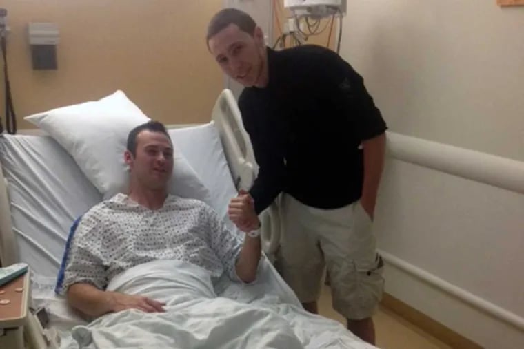 Philadelphia police officer Mark Kimsey, hospitalized following a 2014 accident that left his cruiser on fire, and Joe Chambers, the then 17-year-old from Ridley Park who helped pull the officer from the vehicle.