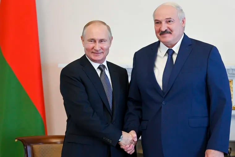 Russian President Vladimir Putin (left) and Belarusian President Alexander Lukashenko pose for a photo during their meeting in St. Petersburg, Russia, Tuesday, July 13, 2021.