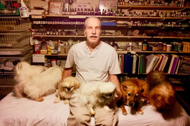 Peter Gerold, a licensed massage therapist, whose body was found dismembered inside a U-Haul truck in Northeast Philadelphia on Feb. 11, 2021. He was pictured here with his dogs for a 2014 article published in the Chestnut Hill Local.