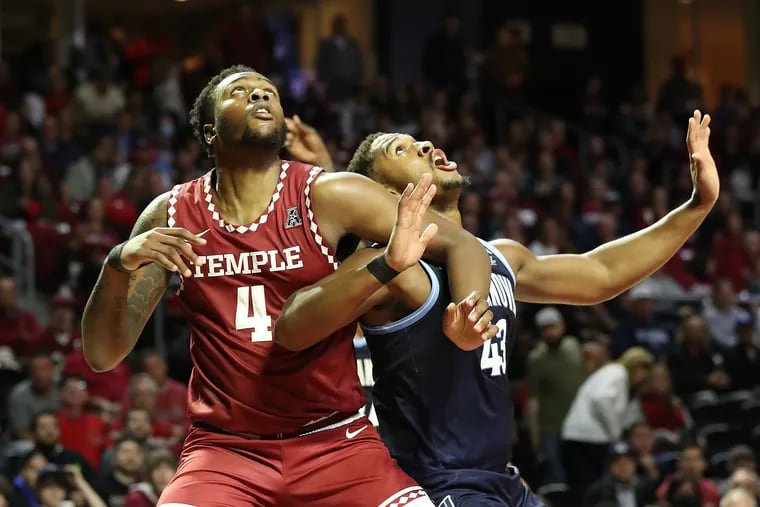 Jamille Reynolds (left) of Temple in action against Eric Dixon of Villanova. (File photo)