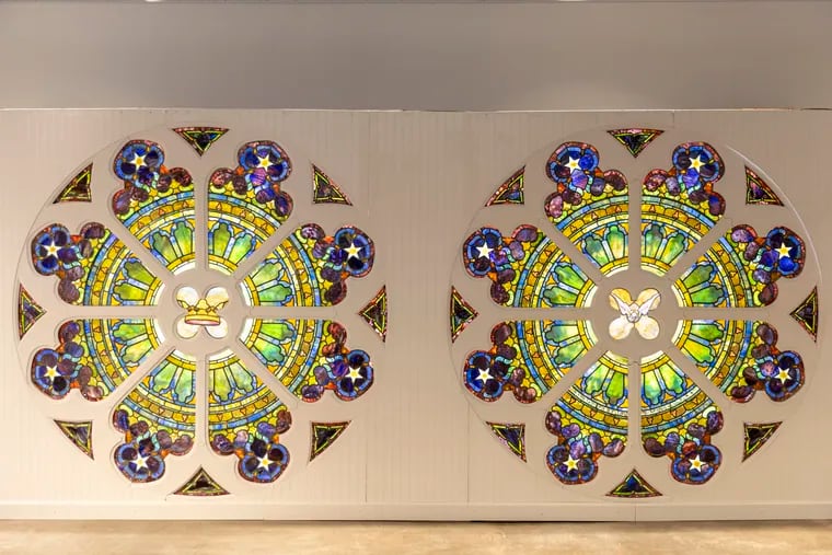 Two rose windows from a historic church at 50th and Baltimore displayed here at Freeman’s auction house in May.