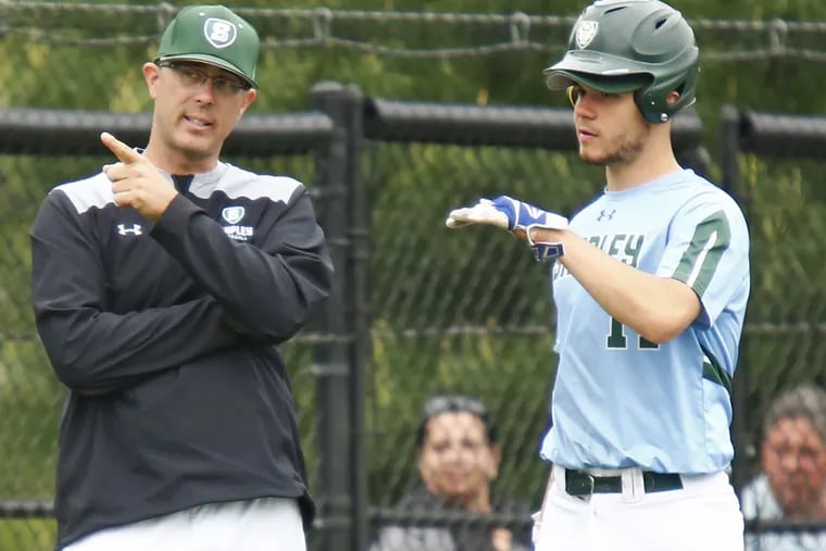 Shipley coach Bryan Bendowski chats with outfielder Jeff Extor (right) during a pitching change by Moorestown Friends in a Friends Schools League baseball semifinal Saturday, May 12, 2018, at Shipley. The host Gators went on to win, 11-0, in five innings.