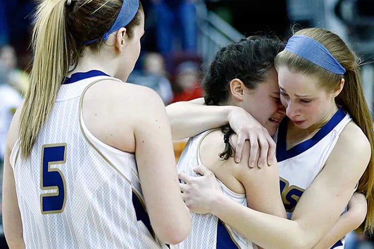 Spring Ford's Shelby Mueller, left, Kaity Dougherty, Julia Roshelli
embrace as they wait to receive their second place awards after being
losing to Cumberland Valley 49-30 in the PIAA Class 4A girls'
basketball championship game, Friday, March 21, 2014, in Hershey, Pa. 
(AP Photo/Matt Rourke)