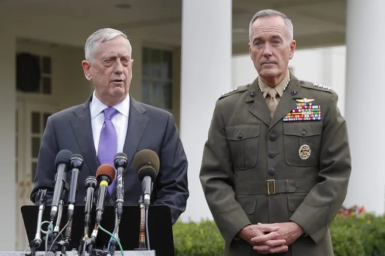 Defense Secretary Jim Mattis (left), accompanied by Joint Chiefs Chairman Gen. Joseph Dunford, speaks to members of the media about North Korea from outside the West Wing of the White House on Sunday.