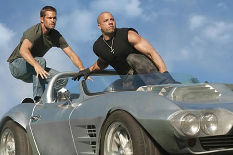 Paul Walker, left, and Vin Diesel in "Fast Five."