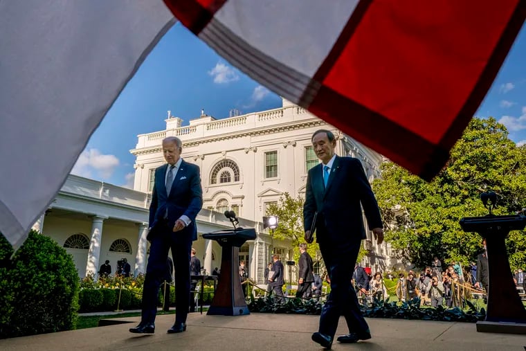 President Joe Biden and Japanese Prime Minister Yoshihide Suga leave a news conference in the Rose Garden of the White House in Washington, Friday, April 16, 2021.