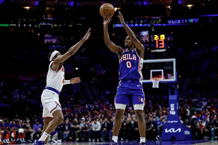 Sixers Tyrese Maxey hit three pointer over Knicks Miles McBride during the first quarter of Game 3 of the NBA Eastern Conference playoffs at the Wells Fargo Center in Philadelphia on Thursday, April 25, 2024.