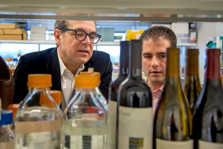 Nicolas Cartier (left) of BioMerieux tours the Invisible Sentinel labs in University City with Invisible Sentinel cofounder Nicholas Siciliano.