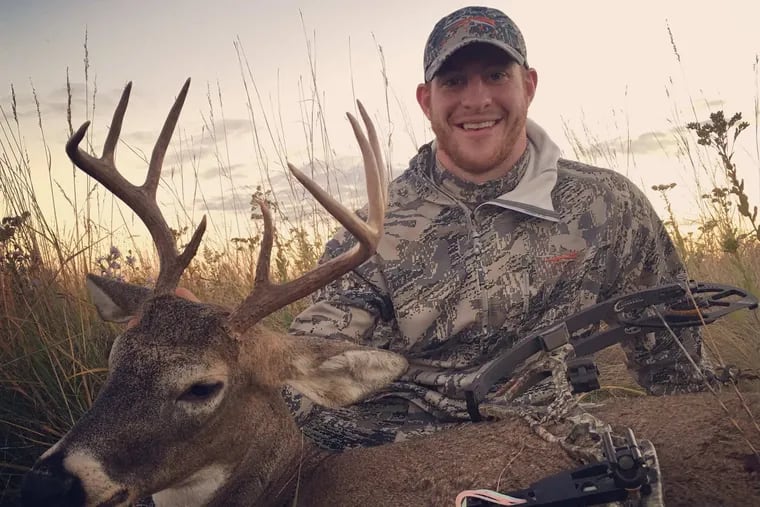 Carson Wentz shows off the buck he killed while hunting during the Eagles' bye week in 2016.