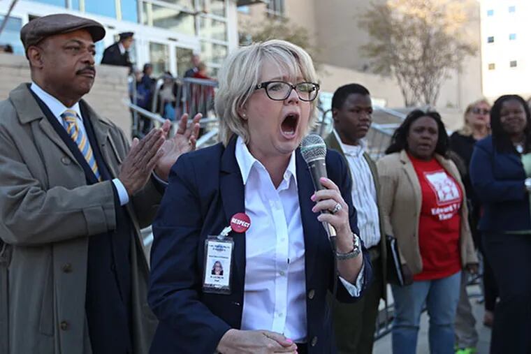 Ann Lacheen, on the School Advisory Committee, speaks to the protesters in front of School District headquarters Thursday, April 24, 2014. ( MICHAEL BRYANT / Staff Photographer )