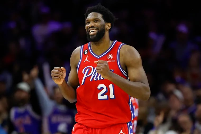 Sixers center Joel Embiid smiles during Friday's game against the Bucks. He finished with 32 points, 11 rebounds, and eight assists.