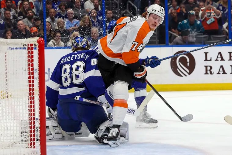 Philadelphia Flyers' Owen Tippett (74) crashes into Tampa Bay Lightning goaltender Andrei Vasilevskiy during the first period of an NHL hockey game Tuesday, March 7, 2023, in Tampa, Fla. (AP Photo/Mike Carlson)
