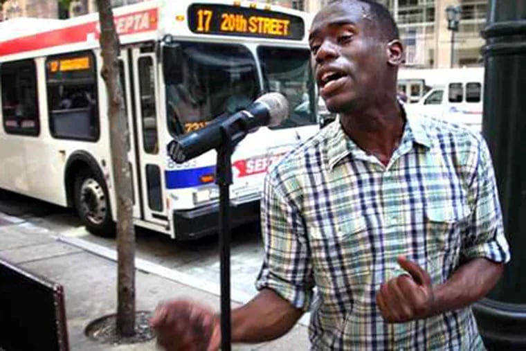 Anthony Riley, performing on Market Street, reached a settlement after his 2007 disorderly-conduct arrest for singing in Rittenhouse Square was deemed wrong. On Tuesday, he will audition for &quot;American Idol.&quot; (Laurence Kesterson / Staff Photographer)