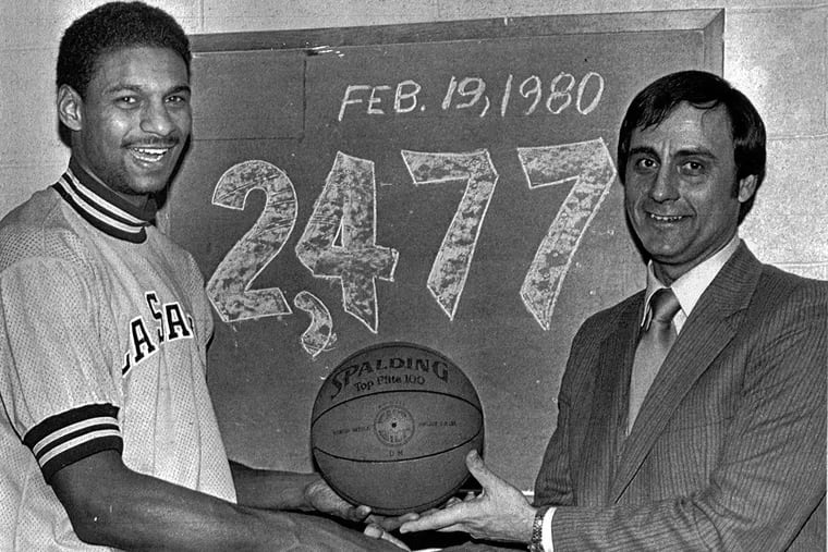 La Salle forward Michael Brooks is congratulated by coach Lefty Ervin after Brooks broke the school's scoring record in February 1980.  Brooks surpassed the mark of 2,462 points set by Tom Gola in 1955.