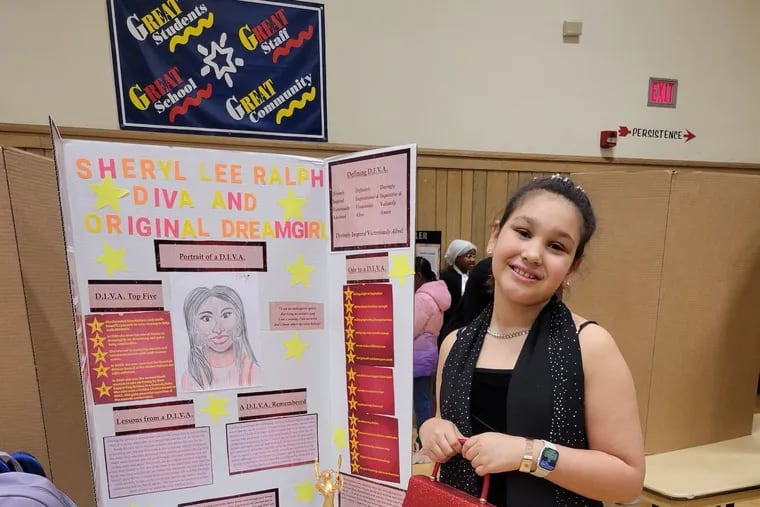 Emily Fleming, 10, a student at Thomas W. Holtzman Jr. Elementary School in Susquehanna Township, with her school project about "Abbott Elementary" star Sheryl Lee Ralph.