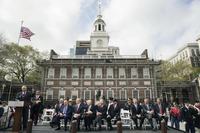 Virginia Governor Terry McAuliffe, at podium on left, speaks in view of Independence Hall during opening ceremonies for Museum of the American Revolution in Philadelphia, Wednesday, April 19, 2017. (AP Photo/Matt Rourke)