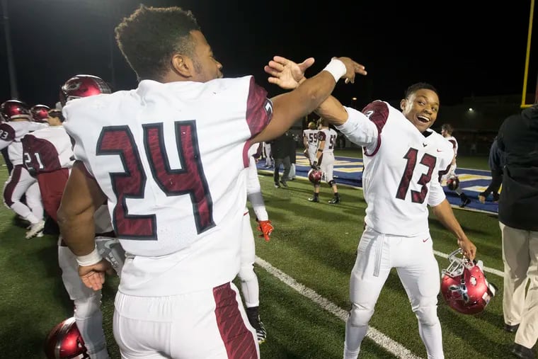 Junior Kolbe Burrell, left, and senior Marques Mason helped ignite St. Joe's Prep to a 13-0 mark and the PIAA Class 6A state championship.