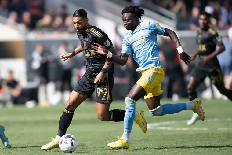 Olivier Mbaizo (right) playing for the Union in last Saturday's MLS Cup final.