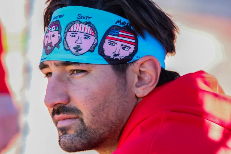 Phillies outfielder Nick Castellanos wears a headband designed by his son Liam. It features Castellanos and a trio of Phillies teammates.