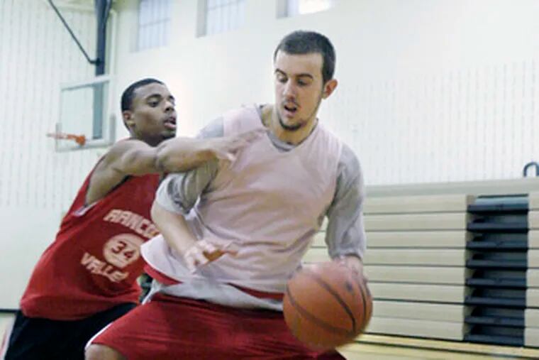 Rancocas Valley&#0039;s Mike Bersch (right) with teammate Shane McLendon in practice on Dec. 9. Bersch was injured Tuesday.