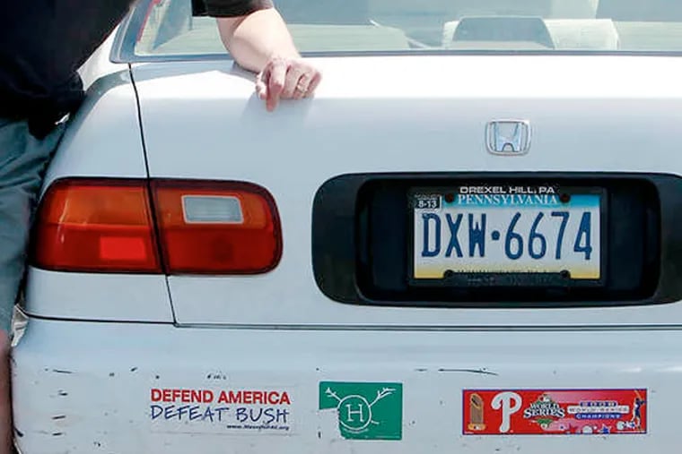 &quot;It's free speech,&quot; Robert Lawley, 59, says of his bumper stickers. He has one that says &quot;Defend America. Defeat Bush.&quot; (AKIRA SUWA / Staff Photographer)