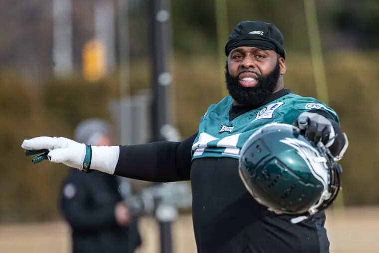 Eagles tackle Jason Peters gesturing to a teammate before a January practice.