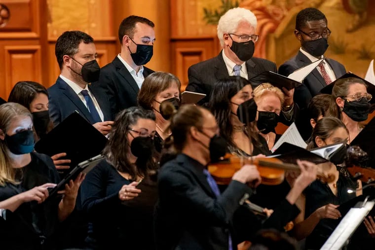 The Choral Arts Society performs in person for the first time since the pandemic, at the Church of the Holy Trinity on Rittenhouse Square on Nov. 10, 2021. Bass singers include Michael Meloy (rear, second from right), who has been with the ensemble since 1983.