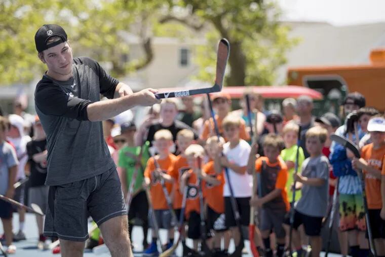 Flyers prospect, Nolan Patrick, demonstrating a wrist shot during a clinic in Stone Harbor last month, will be among the rookies playing on Sept. 13.