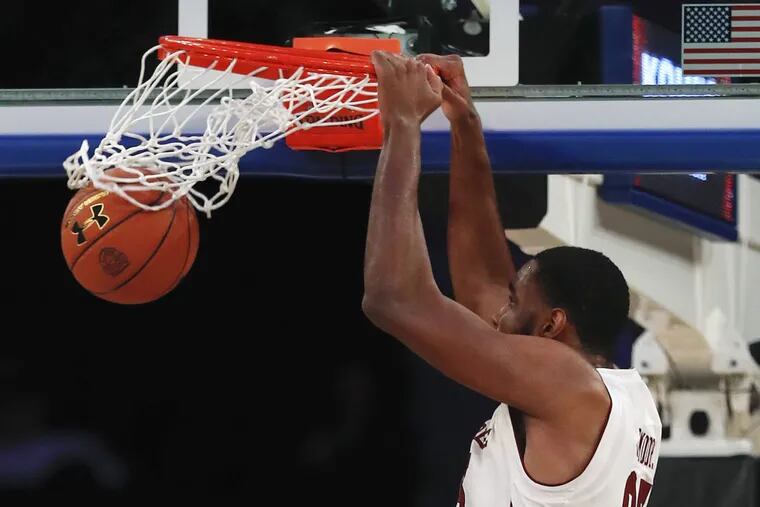 Temple center Damion Moore dunks against South Carolina during the second half of an NCAA college basketball game Thursday, Nov. 30, 2017, in New York. Temple won 76-60. (AP Photo/Julie Jacobson)