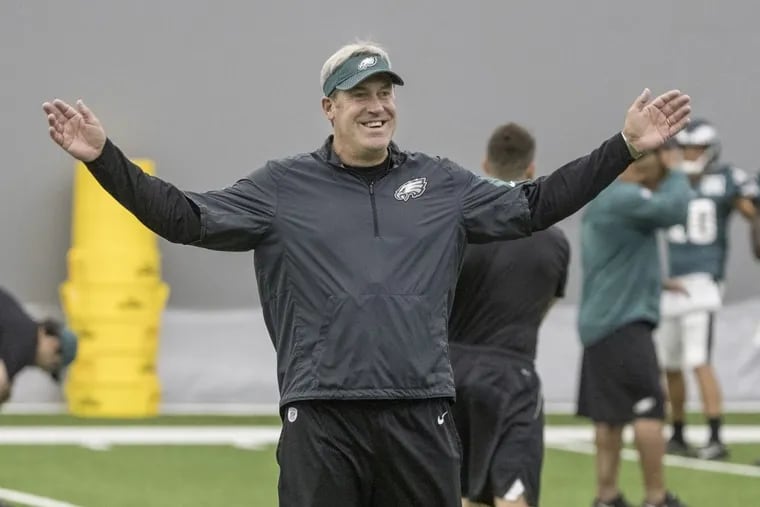 Eagle head coach Doug Pederson is all smiles before practice on Monday, under the big tent at the NovaCare practice facility.