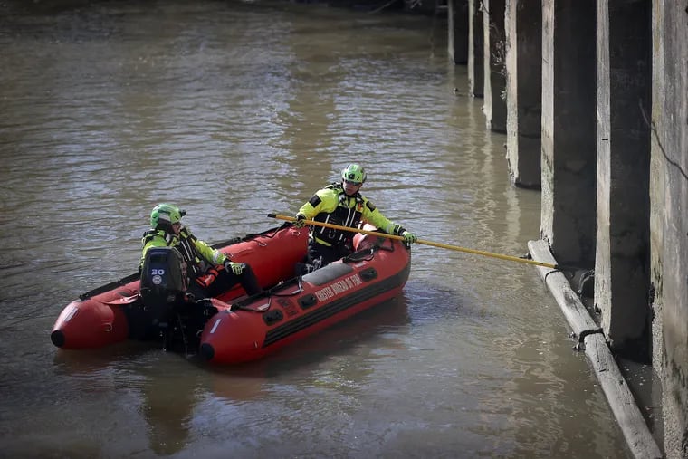 An emergency response crew from the Chester Bureau of Fire search for a missing 6-year-old girl in Chester Creek near 5th Street in Chester, Pa. on Sunday, March 24, 2024.