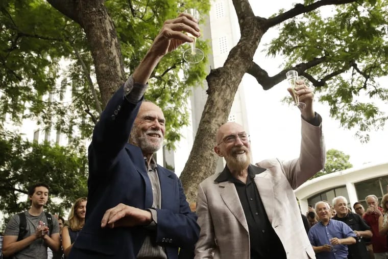 Scientists Barry Barish (left) and Kip Thorne, both of the California Institute of Technology, share a toast to celebrate winning the Nobel Prize in physics on Oct. 3.