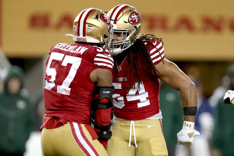 Niners linebackers Fred Warner (54) and Dre Greenlaw anchor one of the top defenses in the league.
