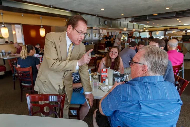 Philadelphia mayoral candidate Alan Butkovitz, former city controller, (left) speaks with Joe DeLullo as he passes out political information at The Dining Car Diner on Frankford Avenue in the Northeast on Sunday May 19, 2019.
