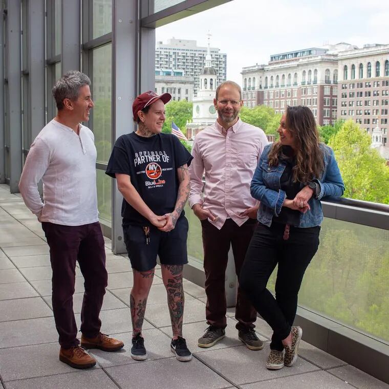 Mike Solomonov (left) with culinary director Caitlin McMillan, business partner Steve Cook, and director of events Neira Jackson at the Weitzman, overlooking Independence Mall.